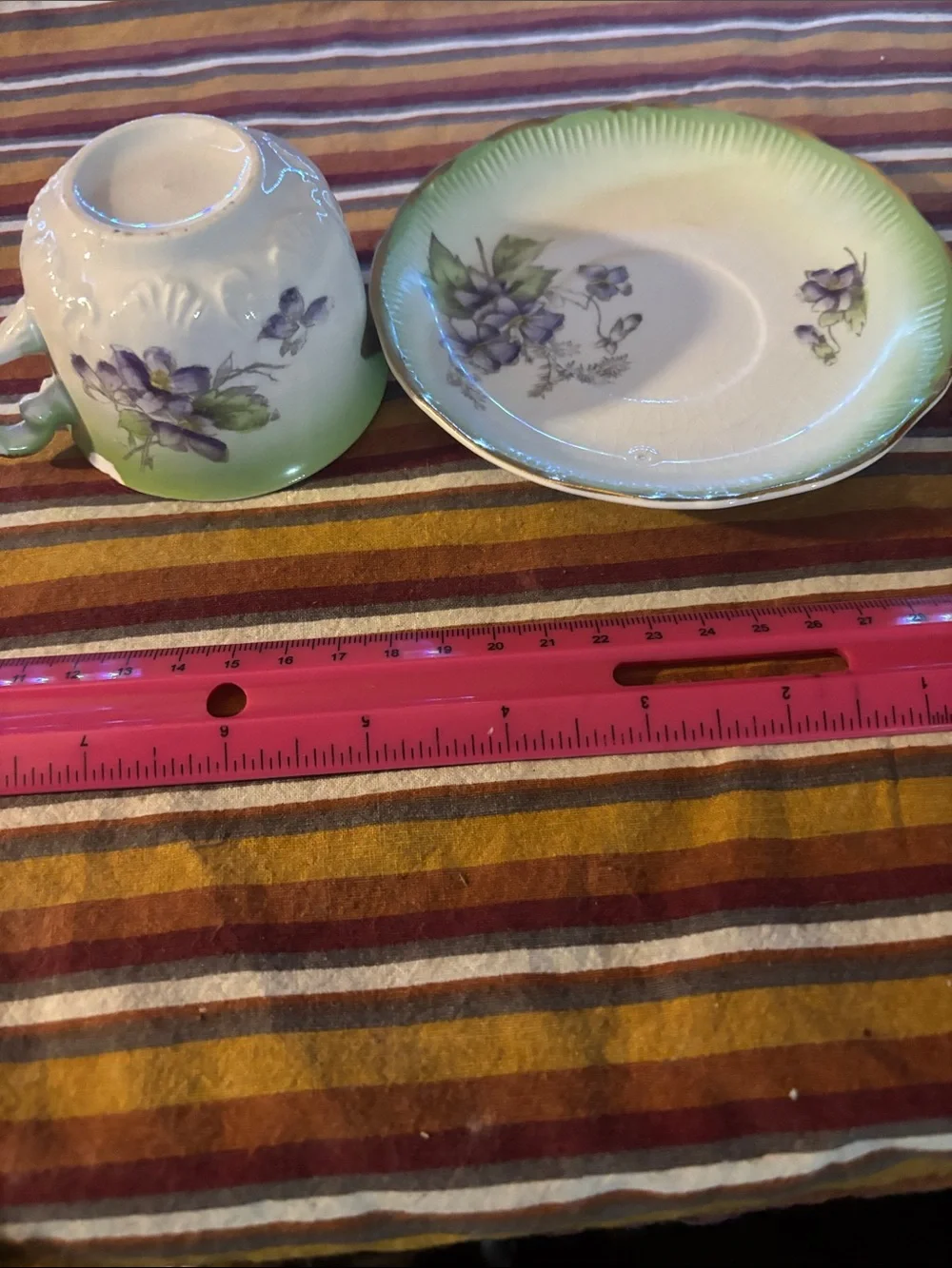 Green Porcelain Teacup and Saucer with Purple Floral Accents